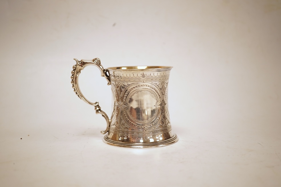 A Victorian bright cut engraved silver christening mug, of waisted form, with engraved inscription and beaded handle, Samuel Roberts & Charles Belk, Sheffield, 1867, 82mm, 5.2oz.